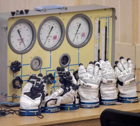 October 8, 2026, Baikonur, Kazakhstan: Baikonur, Kazakhstan. 14 July, 2026. Russian Sokol suit gloves sit beside pressure test equipment inside Building 254 of the Baikonur Cosmodrome before the Expedition 75 launch, July 14, 2026 in Baikonur, Kazakhstan. The crew suited up in the building before launch. Baikonur Kazakhstan - ZUMAp138 20261008_zaa_p138_047 Copyright: xBillxIngalls Nasax