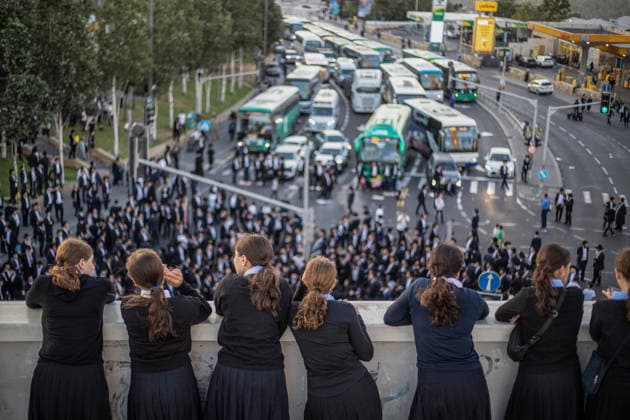 Anti-military service Ultra-Orthodox Jews block road to West Jerusalem JERUSALEM - OCTOBER 8: Ultra-Orthodox Jews, known as Haredi, protest the lack of legislation exempting yeshiva students from mandatory military service and the detention of students on grounds of draft evasion in West Jerusalem, on October 8, 2026. Haredi protesters lie on the road leading to West Jerusalem and block traffic, while Israeli police deployed to the scene intervene against the demonstrators. Mostafa Alkharouf Anadolu Jerusalem Israel. Editorial use only. Please get in touch for any other usage.  Copyright: x2026xAnadoluxMostafaxAlkharoufx