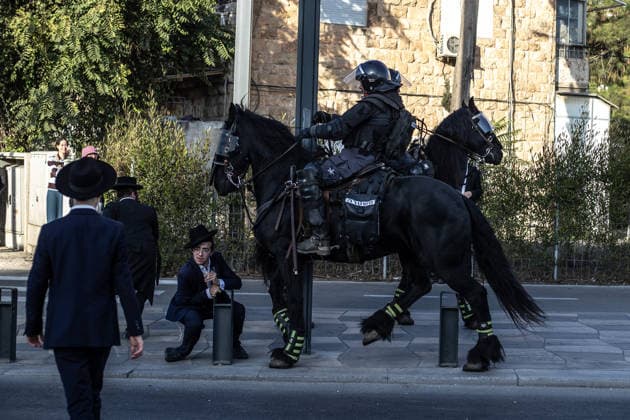Anti-military service Ultra-Orthodox Jews block road to West Jerusalem JERUSALEM - OCTOBER 8: Mounted Israeli police officers on horseback deployed to the scene intervene against demonstrators as Ultra-Orthodox Jews, known as Haredi, protest the lack of legislation exempting yeshiva students from mandatory military service and the detention of students on grounds of draft evasion in West Jerusalem, Israel, on October 8, 2026. Haredi protesters lie on the road leading to West Jerusalem and block traffic. Mostafa Alkharouf Anadolu Jerusalem Israel. Editorial use only. Please get in touch for any other usage.  Copyright: x2026xAnadoluxMostafaxAlkharoufx