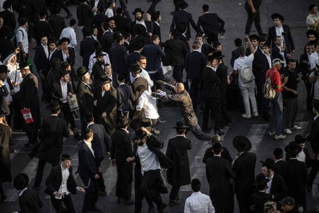 Anti-military service Ultra-Orthodox Jews block road to West Jerusalem JERUSALEM - OCTOBER 8: Ultra-Orthodox Jews, known as Haredi, protest the lack of legislation exempting yeshiva students from mandatory military service and the detention of students on grounds of draft evasion in West Jerusalem, on October 8, 2026. Haredi protesters lie on the road leading to West Jerusalem and block traffic, while Israeli police deployed to the scene intervene against the demonstrators. Mostafa Alkharouf Anadolu Jerusalem Israel. Editorial use only. Please get in touch for any other usage.  Copyright: x2026xAnadoluxMostafaxAlkharoufx