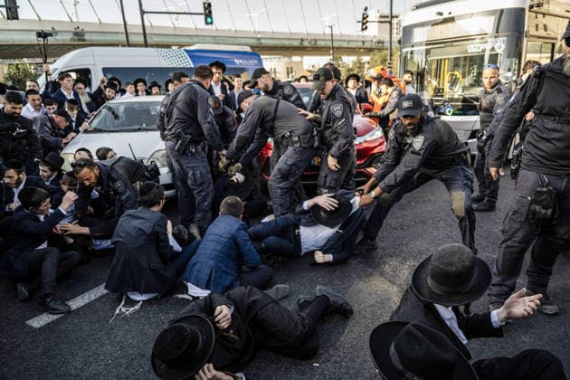 Anti-military service Ultra-Orthodox Jews block road to West Jerusalem JERUSALEM - OCTOBER 8: Israeli police deployed to the scene intervene against the demonstrators as Ultra-Orthodox Jews, known as Haredi, protest the lack of legislation exempting yeshiva students from mandatory military service and the detention of students on grounds of draft evasion in West Jerusalem, on October 8, 2026. Haredi protesters lie on the road leading to West Jerusalem and block traffic. Mostafa Alkharouf Anadolu Jerusalem Israel. Editorial use only. Please get in touch for any other usage.  Copyright: x2026xAnadoluxMostafaxAlkharoufx