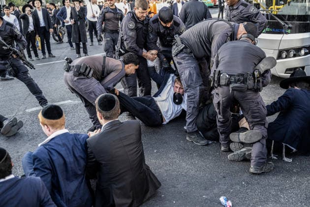 Anti-military service Ultra-Orthodox Jews block road to West Jerusalem JERUSALEM - OCTOBER 8: Israeli police deployed to the scene intervene against the demonstrators as Ultra-Orthodox Jews, known as Haredi, protest the lack of legislation exempting yeshiva students from mandatory military service and the detention of students on grounds of draft evasion in West Jerusalem, on October 8, 2026. Haredi protesters lie on the road leading to West Jerusalem and block traffic. Mostafa Alkharouf Anadolu Jerusalem Israel. Editorial use only. Please get in touch for any other usage.  Copyright: x2026xAnadoluxMostafaxAlkharoufx