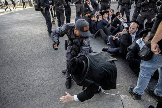 Anti-military service Ultra-Orthodox Jews block road to West Jerusalem JERUSALEM - OCTOBER 8: Israeli police deployed to the scene intervene against the demonstrators as Ultra-Orthodox Jews, known as Haredi, protest the lack of legislation exempting yeshiva students from mandatory military service and the detention of students on grounds of draft evasion in West Jerusalem, on October 8, 2026. Haredi protesters lie on the road leading to West Jerusalem and block traffic. Mostafa Alkharouf Anadolu Jerusalem Israel. Editorial use only. Please get in touch for any other usage.  Copyright: x2026xAnadoluxMostafaxAlkharoufx