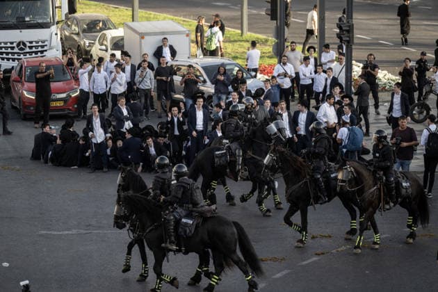 Anti-military service Ultra-Orthodox Jews block road to West Jerusalem JERUSALEM - OCTOBER 8: Mounted Israeli police officers on horseback deployed to the scene intervene against demonstrators as Ultra-Orthodox Jews, known as Haredi, protest the lack of legislation exempting yeshiva students from mandatory military service and the detention of students on grounds of draft evasion in West Jerusalem, Israel, on October 8, 2026. Haredi protesters lie on the road leading to West Jerusalem and block traffic. Mostafa Alkharouf Anadolu Jerusalem Israel. Editorial use only. Please get in touch for any other usage.  Copyright: x2026xAnadoluxMostafaxAlkharoufx