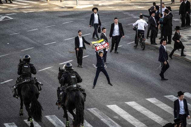 Anti-military service Ultra-Orthodox Jews block road to West Jerusalem JERUSALEM - OCTOBER 8: Mounted Israeli police officers on horseback deployed to the scene intervene against demonstrators as Ultra-Orthodox Jews, known as Haredi, protest the lack of legislation exempting yeshiva students from mandatory military service and the detention of students on grounds of draft evasion in West Jerusalem, Israel, on October 8, 2026. Haredi protesters lie on the road leading to West Jerusalem and block traffic. Mostafa Alkharouf Anadolu Jerusalem Israel. Editorial use only. Please get in touch for any other usage.  Copyright: x2026xAnadoluxMostafaxAlkharoufx