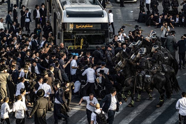 Anti-military service Ultra-Orthodox Jews block road to West Jerusalem JERUSALEM - OCTOBER 8: Mounted Israeli police officers on horseback deployed to the scene intervene against demonstrators as Ultra-Orthodox Jews, known as Haredi, protest the lack of legislation exempting yeshiva students from mandatory military service and the detention of students on grounds of draft evasion in West Jerusalem, Israel, on October 8, 2026. Haredi protesters lie on the road leading to West Jerusalem and block traffic. Mostafa Alkharouf Anadolu Jerusalem Israel. Editorial use only. Please get in touch for any other usage.  Copyright: x2026xAnadoluxMostafaxAlkharoufx