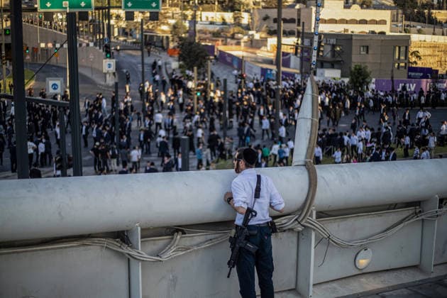 Anti-military service Ultra-Orthodox Jews block road to West Jerusalem JERUSALEM - OCTOBER 8: Ultra-Orthodox Jews, known as Haredi, protest the lack of legislation exempting yeshiva students from mandatory military service and the detention of students on grounds of draft evasion in West Jerusalem, on October 8, 2026. Haredi protesters lie on the road leading to West Jerusalem and block traffic, while Israeli police deployed to the scene intervene against the demonstrators. Mostafa Alkharouf Anadolu Jerusalem Israel. Editorial use only. Please get in touch for any other usage.  Copyright: x2026xAnadoluxMostafaxAlkharoufx