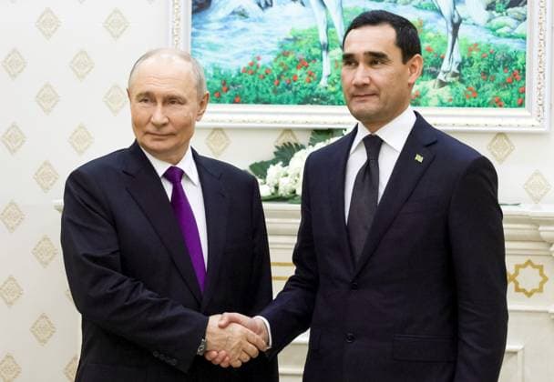 Turkmenistan Russia 9260762 08.10.2026 Russian President Vladimir Putin and Turkmen President Serdar Berdimuhamedov shake hands as they pose for photos before a meeting in Turkmenbashi, Turkmenistan. Gavriil Grigorov Sputnik Turkmenbashi Turkmenistan  Copyright: xGavriilxGrigorovx