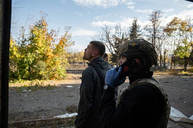 Russian Strike Hits Kramatorsk Buses Two emergency workers look upward at the strike site in Kramatorsk, Donetsk region, Ukraine, on October 8, 2026. Photographer notes said emergency crews temporarily stopped work because a Russian drone was flying above the area. Ukrainian authorities said a Russian guided bomb struck two scheduled passenger buses in Kramatorsk at about 10:00. At least 30 people were killed and at least 18 wounded, while Ukraine s State Emergency Service later reported 33 deaths; public transport in Kramatorsk and nearby Sloviansk was suspended after the attack. Kramatorsk Donetsk Ukraine Copyright: xOrixAviramx