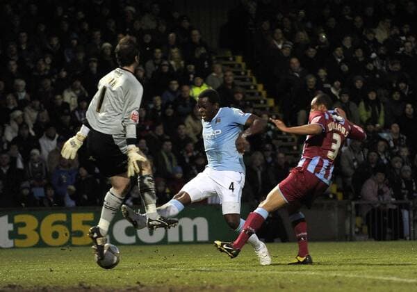 Manchester City s Nedum Onuoha (C) scores their second goal. , EON FA Cup, 4th Round, Scunthorpe United v Manchester City, 24th January, 2010 - EDITORIAL USE ONLY. No use with unauthorised audio, video, data, fixture lists, club league logos or live services. Online in-match use limited to 120 images, no video emulation. No use in betting, games or single club league player publications. o0 Tor