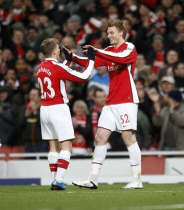 Arsenal s Nicolas Bendtner (R) celebrates scoring his first goal with Andrei Arshavin , UEFA Champions League, Arsenal FC London - FC Porto, 9th March, 2010 - EDITORIAL USE ONLY. No use with unauthorised audio, video, data, fixture lists, club league logos or live services. Online in-match use limited to 120 images, no video emulation. No use in betting, games or single club league player publications. o0 Jubel, Freude