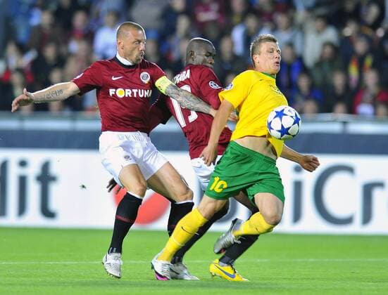 Tomas Repka, left, and Adiaba Bondoa, centre, of Sparta Praha, right, fight for the ball with MSK Zilina player Tomas Majtan, right, in their Champions League qualifying play-off first leg match in Prague Tuesday, Aug. 17, 2010. (CTKxPhoto KaterinaxSulova) CTKPhoto577201008170784201