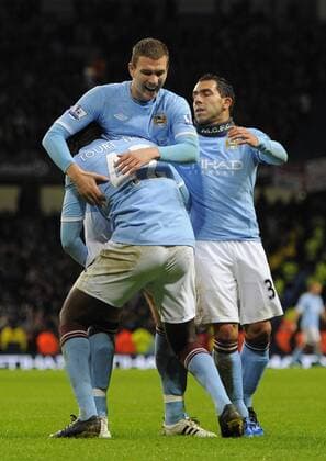 Yaya Toure of Manchester City (L) celebrates his goal with new signing Edin Dzeko of Manchester City - Manchester City - Wolverhampton Wanderers - EDITORIAL USE ONLY. No use with unauthorised audio, video, data, fixture lists, club league logos or live services. Online in-match use limited to 120 images, no video emulation. No use in betting, games or single club league player publications.