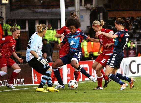 Wendie Renard of Olympique Lyonnais scores her side s first goal during the UEFA Women s Champions League final football match between Olympique Lyonnais and FFC Turbine Potsdam at Craven Cottage, London, England, on May 26, 2011. Photo Credit SPORTIMAGE JAKE BADGER UEFA Women s Champions League Final Olympique Lyonnais v Potsdam 26th May, 2011 EDITORIAL USE ONLY. No use with unauthorised audio, video, data, fixture lists, club league logos or live services. Online in-match use limited to 120 images, no video emulation. No use in betting, games or single club league player publications.