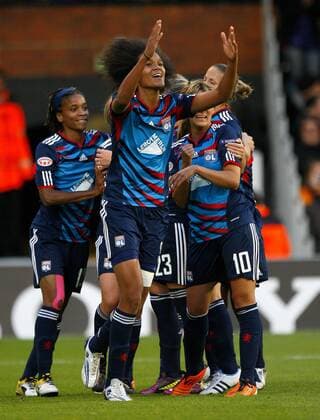 Wendie Renard of Olympique Lyonnais celebrates scoring her side s first goal during the UEFA Women s Champions League final football match between Olympique Lyonnais and FFC Turbine Potsdam at Craven Cottage, London, England, on May 26, 2011. Photo Credit SPORTIMAGE JAKE BADGER UEFA Women s Champions League Final Olympique Lyonnais v Potsdam 26th May, 2011 EDITORIAL USE ONLY. No use with unauthorised audio, video, data, fixture lists, club league logos or live services. Online in-match use limited to 120 images, no video emulation. No use in betting, games or single club league player publications.
