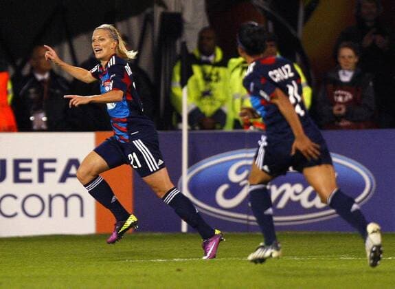 Lara Dickenmann of Olympique Lyonnais celebrates scoring her side s second goal during the UEFA Women s Champions League final football match between Olympique Lyonnais and FFC Turbine Potsdam at Craven Cottage, London, England, on May 26, 2011. Photo Credit SPORTIMAGE JAKE BADGER UEFA Women s Champions League Final Olympique Lyonnais v Potsdam 26th May, 2011 EDITORIAL USE ONLY. No use with unauthorised audio, video, data, fixture lists, club league logos or live services. Online in-match use limited to 120 images, no video emulation. No use in betting, games or single club league player publications.