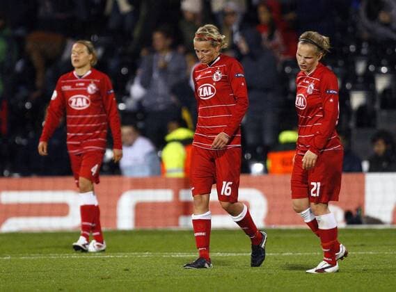 Dejection for FFC Turbine Potsdam after Olympique Lyonnais scored a second goal during the UEFA Women s Champions League final football match between Olympique Lyonnais and FFC Turbine Potsdam at Craven Cottage, London, England, on May 26, 2011. Photo Credit SPORTIMAGE JAKE BADGER UEFA Women s Champions League Final Olympique Lyonnais v Potsdam 26th May, 2011 EDITORIAL USE ONLY. No use with unauthorised audio, video, data, fixture lists, club league logos or live services. Online in-match use limited to 120 images, no video emulation. No use in betting, games or single club league player publications.
