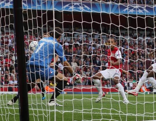 Arsenals Theo Walcott scoring his sides opening goal UEFA Champions League Qualifying Arsenal FC London vs Udinese Calcio 16th August, 2011 EDITORIAL USE ONLY. No use with unauthorised audio, video, data, fixture lists, club league logos or live services. Online in-match use limited to 120 images, no video emulation. No use in betting, games or single club league player publications.