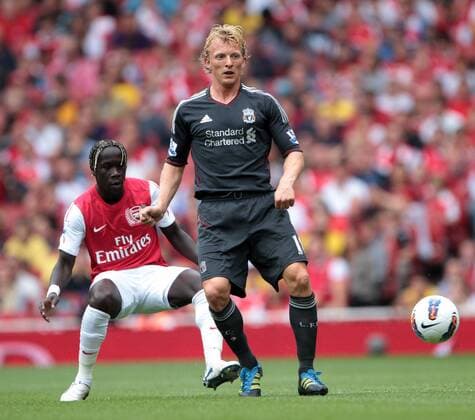 Arsenals Bacary Sagna tussles with Liverpools Dirk Kuyt Barclays Premier League Arsenal FC v Liverpool FC 20th August, 2011 EDITORIAL USE ONLY. No use with unauthorised audio, video, data, fixture lists, club league logos or live services. Online in-match use limited to 120 images, no video emulation. No use in betting, games or single club league player publications.