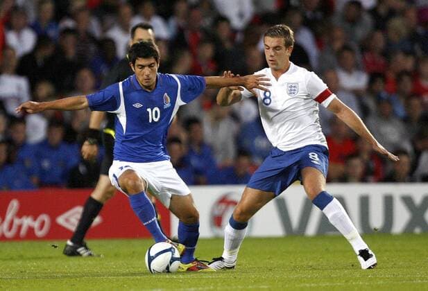 Eshgin Guliyev of Azerbaijan holds off Jordan Henderson of England during the Under-21 Euro 2013 qualifying match between England and Azerbaijan at Vicarage Road, Watford, England, on September 1, 2011. Photo Credit SPORTIMAGE JAKE BADGER UEFA Under 21 Championship Qualifying England U21 v Azerbaijan U21 1st September, 2011 EDITORIAL USE ONLY. No use with unauthorised audio, video, data, fixture lists, club league logos or live services. Online in-match use limited to 120 images, no video emulation. No use in betting, games or single club league player publications.