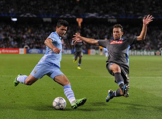 Sergio Kun Aguero of Manchester City tussles with Hugo Campagnaro of SSC Napoli UEFA Champions League Group A Manchester City v Napoli 14th September, 2011 EDITORIAL USE ONLY. No use with unauthorised audio, video, data, fixture lists, club league logos or live services. Online in-match use limited to 120 images, no video emulation. No use in betting, games or single club league player publications.