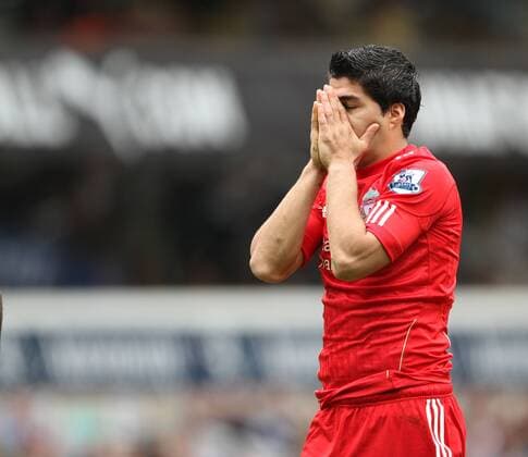 Liverpools Luis Suarez looks on dejected Barclays Premier League - Tottenham Hotspur v Liverpool FC - EDITORIAL USE ONLY. No use with unauthorised audio, video, data, fixture lists, club league logos or live services. Online in-match use limited to 120 images, no video emulation. No use in betting, games or single club league player publications.