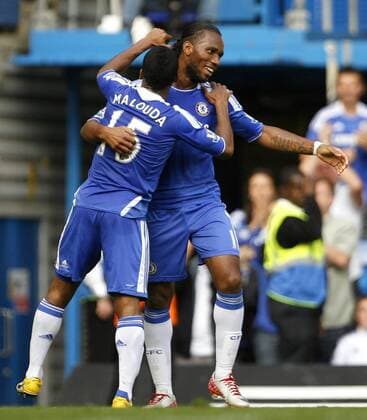 Didier Drogba of Chelsea celebrates scoring his side s fourth goal with Florent Malouda of Chelsea during the Premier League match between Chelsea and Swansea City at Stamford Bridge, London, England, on September 24, 2011. Photo Credit SPORTIMAGE JAKE BADGER Barclays Premier League Chelsea v Swansea City 24th September, 2011 EDITORIAL USE ONLY. No use with unauthorised audio, video, data, fixture lists, club league logos or live services. Online in-match use limited to 120 images, no video emulation. No use in betting, games or single club league player publications.