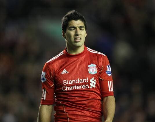 Liverpools Luis Suarez looks on dejected Barclays Premier League Liverpool v Norwich City 22nd October, 2011 EDITORIAL USE ONLY. No use with unauthorised audio, video, data, fixture lists, club league logos or live services. Online in-match use limited to 120 images, no video emulation. No use in betting, games or single club league player publications.