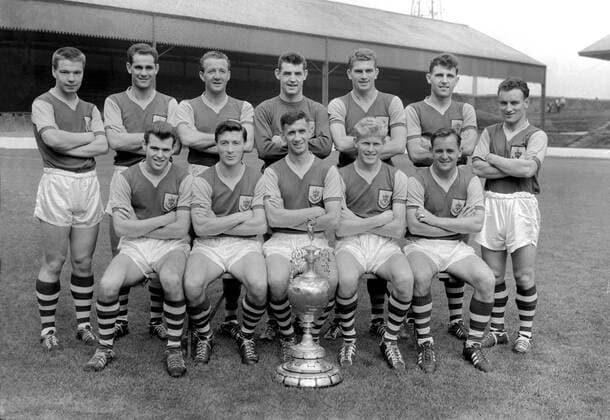 Football - First Division 1960 1961 - Burnley FC Team Group, 1960 League Champions Back (left to right): Alex Elder, J Robson, Tommy Cummings, Adam Blacklaw, Brian Miller, J Angus, Trevor Meredith. Front: John Connelly, Jimmy McIlroy, Jimmy Adamson, Ray Pointer, Brian Pilkington. sw
