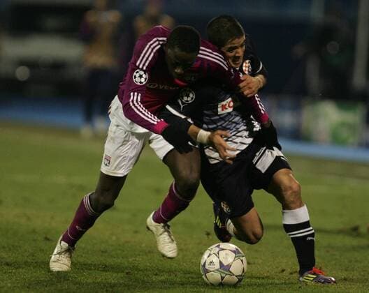 Zagreb, 07.12.2011. Champion league, Group D, Maksimir stadium, GNK Dinamo (dark blue) - Olimpique Lyonnais (magenta) 1:7. Mouhamadou Dabo (L) and Luis Ibanez (3)
