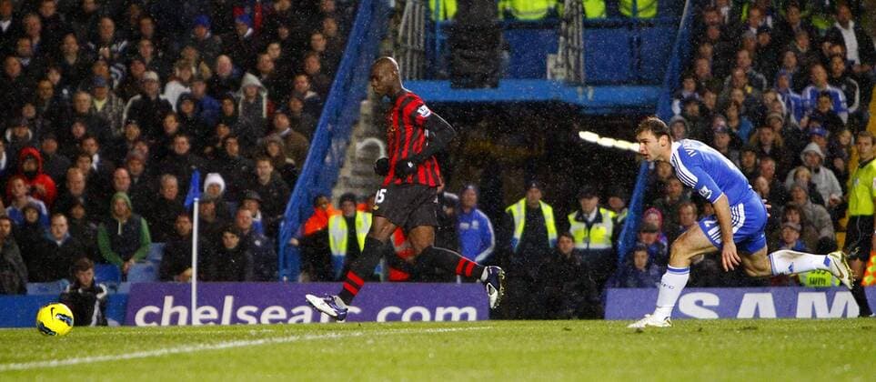 Mario Balotelli of Manchester City scores his side s first goal during the Premier League match between Chelsea and Manchester City at Stamford Bridge, London, England, on December 12, 2011 EDITORIAL USE ONLY. No use with unauthorised audio, video, data, fixture lists, club league logos or live services. Online in-match use limited to 120 images, no video emulation. No use in betting, games or single club league player publications.