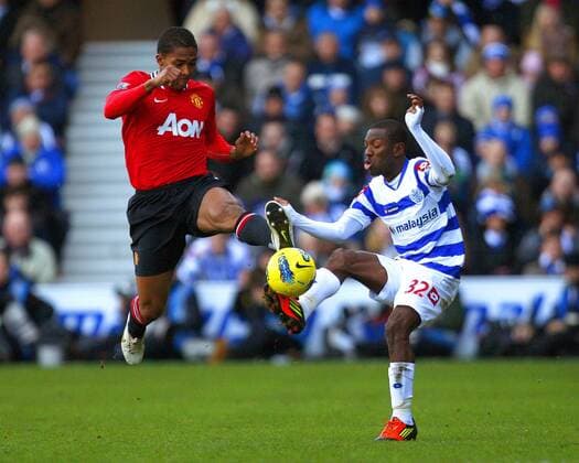 Luis Antonio Valencia of Manchester United and Shaun Wright-Phillips of Queens Park Rangers fight for the ball during the Premier League match between Queens Park Rangers and Manchester United at Loftus Road, London, England, on December 18, 2011 Barclays Premier League QPR Queens Park Rangers vs Manchester United (ManU) 18th December, 2011 EDITORIAL USE ONLY. No use with unauthorised audio, video, data, fixture lists, club league logos or live services. Online in-match use limited to 120 images, no video emulation. No use in betting, games or single club league player publications.