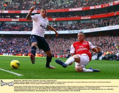 Football - Premier League - Arsenal FC London vs. Tottenham Hotspur - Arsenal s Kieran Gibbs gets a cross past Tottenham s Kyle Walker at the Emirates Stadium