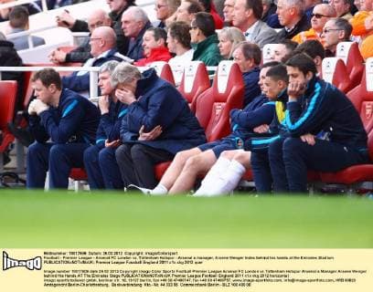 Football - Premier League - Arsenal FC London vs. Tottenham Hotspur - Arsenal s manager, Arsene Wenger hides behind his hands at the Emirates Stadium