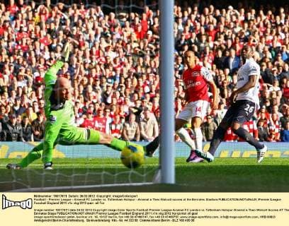 Football - Premier League - Arsenal FC London vs. Tottenham Hotspur - Arsenal s Theo Walcott scores at the Emirates Stadium