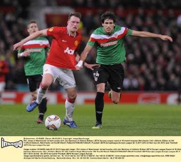 Phil Jones of Manchester United tussles with Javi Martinez of Athletic Bilbao..UEFA Europa League round of 16 match between Manchester Utd v Athletic Bilbao at Old Trafford Stadium, Manchester on the 8th March EDITORIAL USE ONLY. No use with unauthorised audio, video, data, fixture lists, club league logos or live services. Online in-match use limited to 120 images, no video emulation. No use in betting, games or single club league player publications.