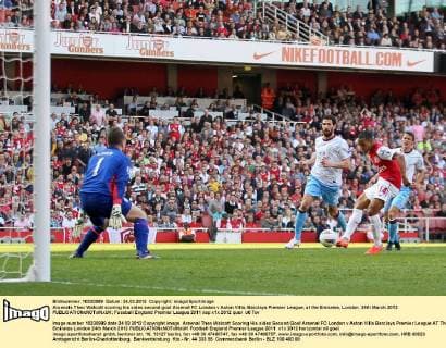 Arsenals Theo Walcott scoring his sides second goal Arsenal FC London v Aston Villa, Barclays Premier League, at the Emirates, London. 24th March 2012 EDITORIAL USE ONLY. No use with unauthorised audio, video, data, fixture lists, club league logos or live services. Online in-match use limited to 120 images, no video emulation. No use in betting, games or single club league player publications.
