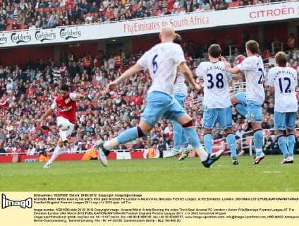 Arsenals Mikel Arteta scoring his sides third goal Arsenal FC London v Aston Villa, Barclays Premier League, at the Emirates, London. 24th March 2012 EDITORIAL USE ONLY. No use with unauthorised audio, video, data, fixture lists, club league logos or live services. Online in-match use limited to 120 images, no video emulation. No use in betting, games or single club league player publications.