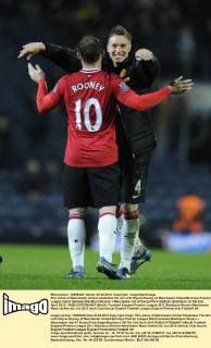 Phil Jones of Manchester United celebrates the win with Wayne Rooney of Manchester United.Barclays Premier League match between Blackburn Rovers v Manchester Utd at Ewood Park Stadium, Blackburn on the 2nd April 2012 - EDITORIAL USE ONLY. No use with unauthorised audio, video, data, fixture lists, club league logos or live services. Online in-match use limited to 120 images, no video emulation. No use in betting, games or single club league player publications.