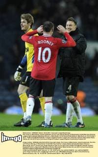 Phil Jones of Manchester United celebrates the win with Wayne Rooney of Manchester United.Barclays Premier League match between Blackburn Rovers v Manchester Utd at Ewood Park Stadium, Blackburn on the 2nd April 2012 - EDITORIAL USE ONLY. No use with unauthorised audio, video, data, fixture lists, club league logos or live services. Online in-match use limited to 120 images, no video emulation. No use in betting, games or single club league player publications.
