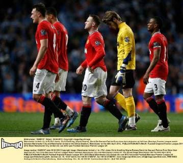 Manchester United s (L to R) Phil Jones, Chris Smalling, Wayne Rooney, David De Gea and Patrice Evra show their dejection at full time..Barclays Premier League match between Manchester City and Manchester United at the Etihad Stadium, Manchester on the 30th April 2012.. EDITORIAL USE ONLY. No use with unauthorised audio, video, data, fixture lists, club league logos or live services. Online in-match use limited to 120 images, no video emulation. No use in betting, games or single club league player publications.