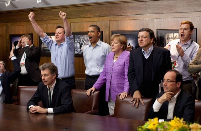 Champions League Finale 2012 - Prime Minister David Cameron of the United Kingdom, President Barack Obama, Chancellor Angela Merkel of Germany, Jose Manuel Barroso, President of the European Commission, President Francois Hollande of France, and others watch the overtime shootout of the FC Chelsea vs. Bayern Munich Champions League final, in the Laurel Cabin conference room during the G8 Summit at Camp David, Maryland, May 19, 2012