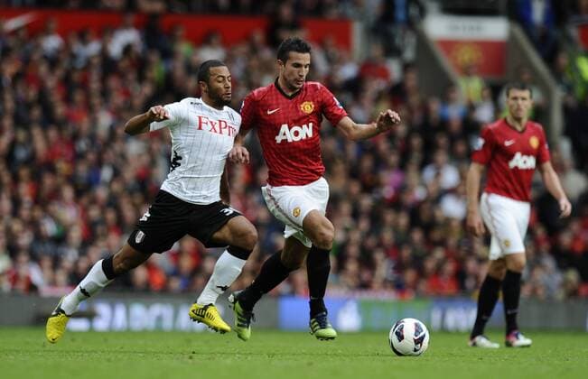 Robin van Persie of Manchester United tussles with Moussa Dembele of Fulham Barclays Premier League; Manchester United (ManU) - Fulham FC at Old Trafford, Manchester on the 25th August 2012. EDITORIAL USE ONLY. No use with unauthorised audio, video, data, fixture lists, club league logos or live services. Online in-match use limited to 120 images, no video emulation. No use in betting, games or single club league player publications.