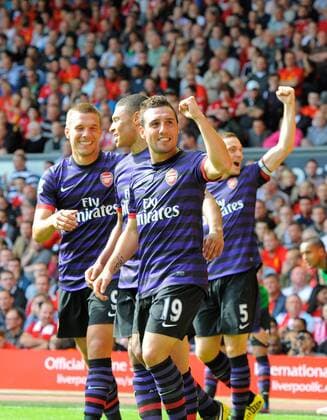 Football - Liverpool v Arsenal - Barclays Premier League - Anfield Stadium - Season 12 13 - 2 9 12 .Santi Cazorla of Arsenal celebrates with Lucas Podolski of Arsenal.Mandatory Credit: Simon Bellis Sportimage.EDITORIAL USE ONLY. No use with unaurthorized audio, video, data, fixture lists, club league logos or ?live? services. Online in-match use limited to 45 images, no video emulation. No use in betting, games or single club league player publications. Please contact your account representative for further details... EDITORIAL USE ONLY. No use with unauthorised audio, video, data, fixture lists, club league logos or live services. Online in-match use limited to 120 images, no video emulation. No use in betting, games or single club league player publications.