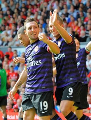 Football - Liverpool v Arsenal - Barclays Premier League - Anfield Stadium - Season 12 13 - 2 9 12 .Santi Cazorla of Arsenal celebrates with Lucas Podolski of Arsenal.Mandatory Credit: Simon Bellis Sportimage.EDITORIAL USE ONLY. No use with unaurthorized audio, video, data, fixture lists, club league logos or ?live? services. Online in-match use limited to 45 images, no video emulation. No use in betting, games or single club league player publications. Please contact your account representative for further details... EDITORIAL USE ONLY. No use with unauthorised audio, video, data, fixture lists, club league logos or live services. Online in-match use limited to 120 images, no video emulation. No use in betting, games or single club league player publications.
