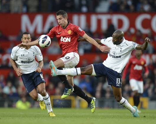 Robin van Persie of Manchester United tussles with William Gallas of Tottenham -Barclays Premier League - Manchester United ManU vs Tottenham Hotspur - Old Trafford Stadium - Manchester - 29 09 12 - EDITORIAL USE ONLY. No use with unauthorised audio, video, data, fixture lists, club league logos or live services. Online in-match use limited to 120 images, no video emulation. No use in betting, games or single club league player publications.