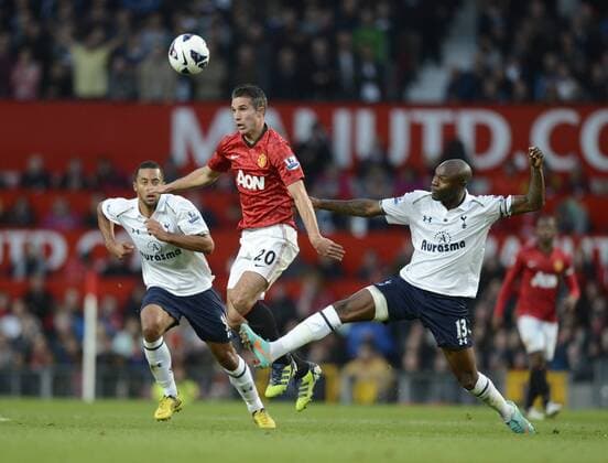 Robin van Persie of Manchester United tussles with William Gallas of Tottenham - Barclays Premier League - Manchester Utd vs Tottenham - Old Trafford Stadium - Manchester - 29 09 12 - Picture Simon Bellis Sportimage EDITORIAL USE ONLY. No use with unauthorised audio, video, data, fixture lists, club league logos or live services. Online in-match use limited to 120 images, no video emulation. No use in betting, games or single club league player publications.