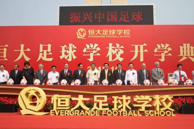 Marcello Lippi, second right, head coach of Guangzhou Evergrande FC, Xu Jiayin (Hui Ka Yan), sixth right, Chairman of Evergrande Real Estate Group, Cai Zhenhua, seventh left, Deputy Director of the General Administration of of China, Wei Di, fifth right, head of the Chinese Football Association, Jenny Lang Ping, third left, head coach of Guangdong Evergrande Volleyball Club, and other guests attend the opening ceremony of the new term at Evergrande Football School in Guangzhou city, south Chinas Guangdong province, 9 October 2012. Italian football coach Marcello Lippi got a new title on Tuesday (9 October 2012) months after he became the head coach of Chinas Guangzhou Evergrande FC. Lippi was named president of Evergrande Football School which is sponsored by Chinese real estate developer Evergrande Group. Lippi named president of Evergrande Football School 20121009_35293