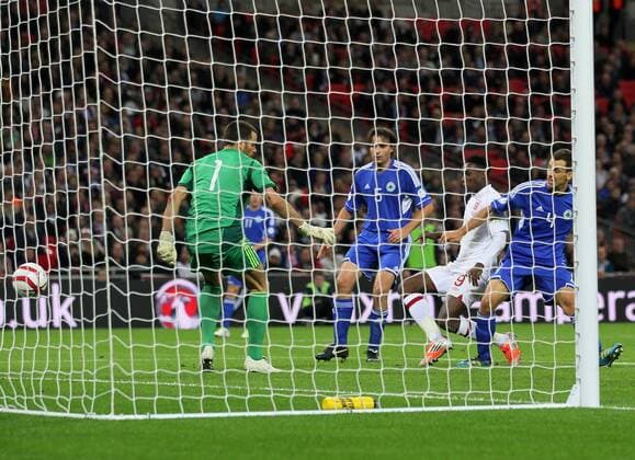 England s Danny Welbeck scoring his sides fourth goal..England v San Marino - FIFA World Cup Qualifier - Wembley Stadium- 12 10 12 - Picture David Klein Sportimage EDITORIAL USE ONLY. No use with unauthorised audio, video, data, fixture lists, club league logos or live services. Online in-match use limited to 120 images, no video emulation. No use in betting, games or single club league player publications.