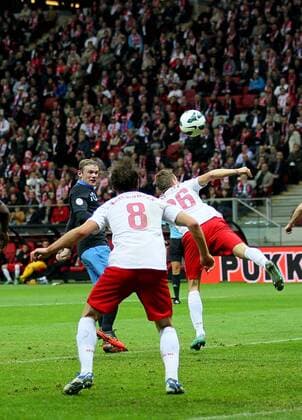 England s Wayne Rooney scoring his sides opening goal..Poland v England - FIFA World Cup Qualifier - National Stadium, Warsaw Stadium- 17 10 12 - Picture David Klein Sportimage EDITORIAL USE ONLY. No use with unauthorised audio, video, data, fixture lists, club league logos or live services. Online in-match use limited to 120 images, no video emulation. No use in betting, games or single club league player publications.